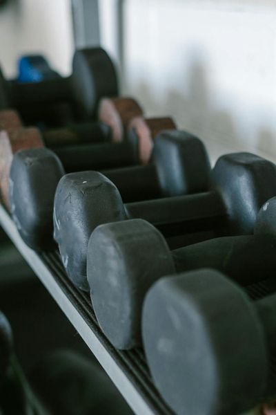 Close-up on equipment used for exercise, like kettlebell or mat.